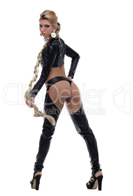 Young dancer in black latex costume with braid