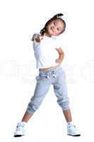 Happy little girl in sportswear thumbs up isolated