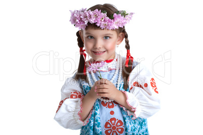 Cute little girl in slavic costume and garland