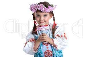 Cute little girl in slavic costume and garland