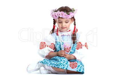 Pretty little girl in blue slavic costume