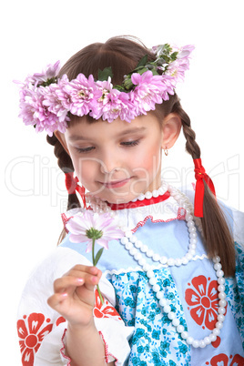 Beautiful girl in slavic costume and garland