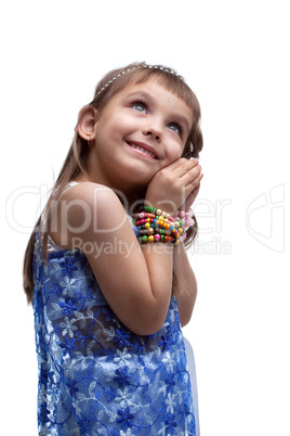 Happy little girl in indian costume dreaming
