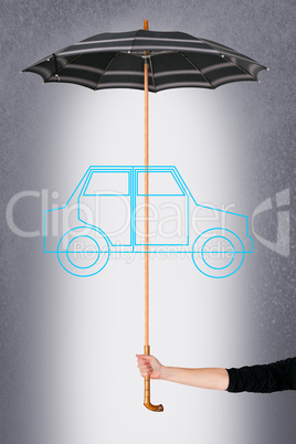 Hand holding umbrella over symbolic car