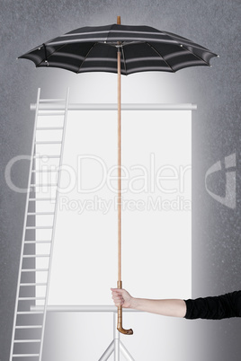 Hand holding umbrella over billboard
