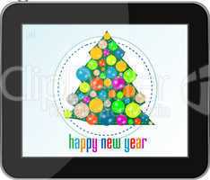 christmas tree with balls on tablet pc