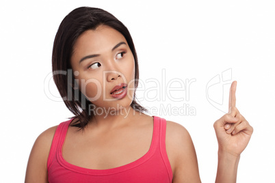 Surprised Asian woman pointing upwards