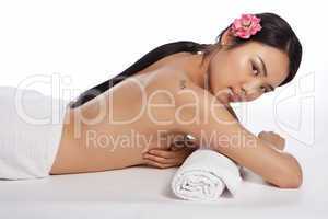 Beautiful topless Asian woman at a spa