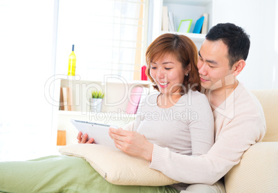 Asian couple with digital tablet computer