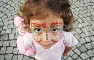 Little Girl With Face Paint Looking Up
