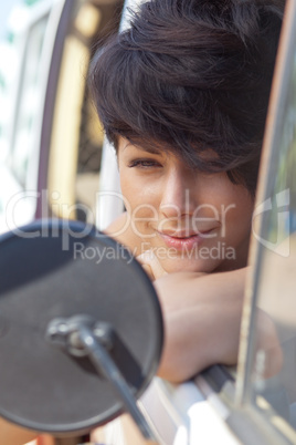 a beautiful young girl with short hair cut and blue eyes