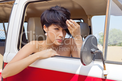 a beautiful young girl with short hair cut and blue eyes