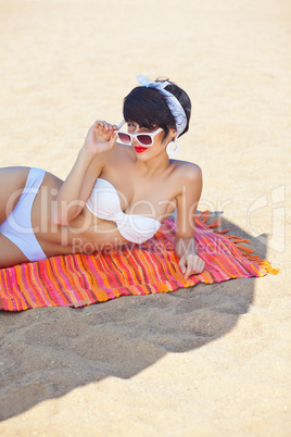 a beautiful young girl in retro look with red lips