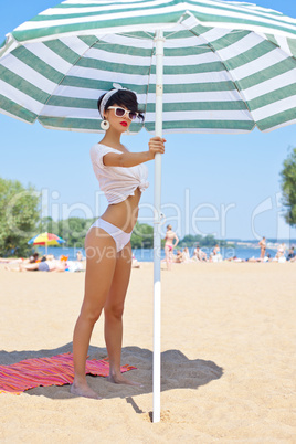 a beautiful young girl in retro look with red lips