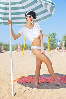 a beautiful young girl in retro look with red lips