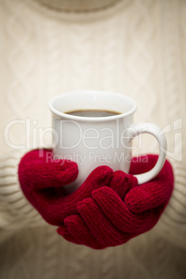 Woman in Sweater with Red Mittens Holding Cup of Coffee