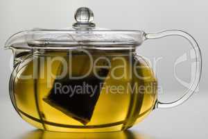 Glass tea pot with tea bag