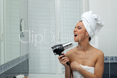 Young woman singing in bathroom