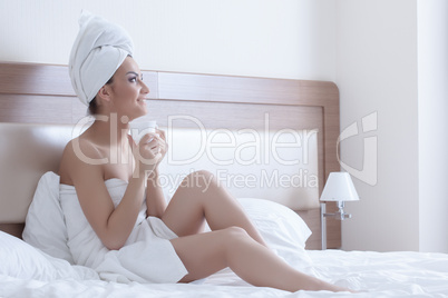brunette woman wearing towels on her body