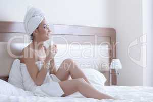 brunette woman wearing towels on her body