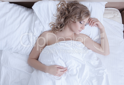 Pretty woman sleep in morning bed