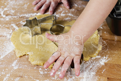 small childrens hands with dough