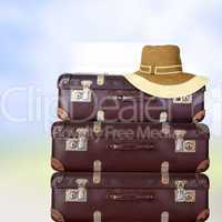 Old suitcase with women's hat
