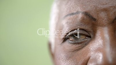 Old black woman portrait, close-up of eye, mouth and face