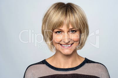 Happy middle aged woman posing for a portrait