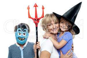 Mom with son and daughter. Halloween dress up.
