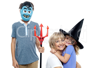 Young boy and cute girl participating in halloween celebration