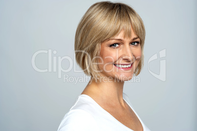 Snap shot of a cheerful blonde, side pose