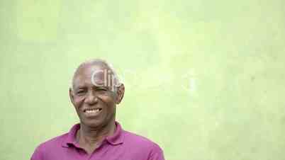 Elderly people portrait, happy old black man smiling at camera