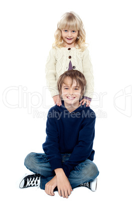 Affectionate brother and sister posing for a portrait