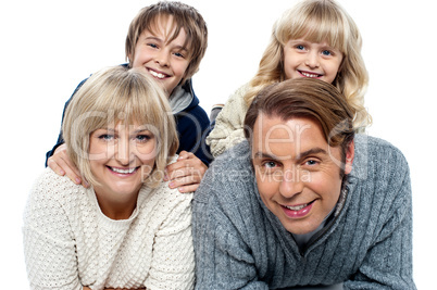 Spirited kids having fun with their parents indoors