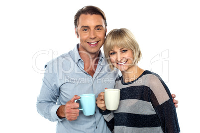 Couple starting their day with a cup of coffee