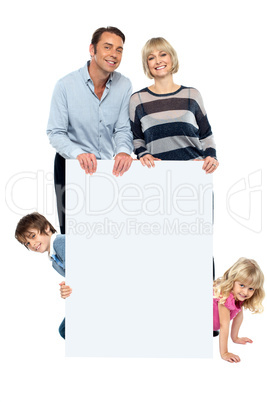 Lively family of four all around blank whiteboard