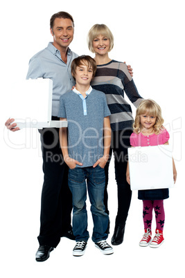 Family of four. Father and daughter holding pizza boxes.