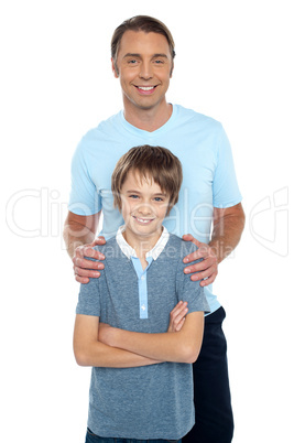 Middle aged father posing with his smart son