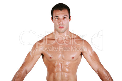 Muscular shirtless man after work out, looking at camera