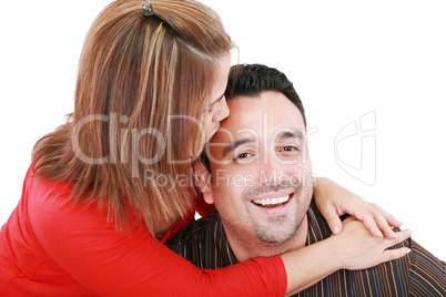 Beautiful woman kisses her husband, isolated on white