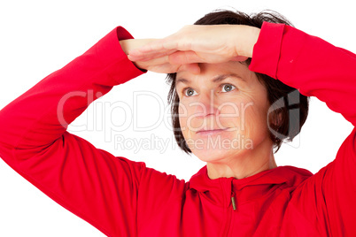 Woman holds open hand to his forehead and looks into the distance
