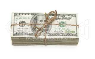 Stack of One Hundred Dollar Bills Tied in a Burlap String on Whi