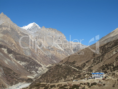 Lodge And Mountains On The Way To The Thorung La Pass