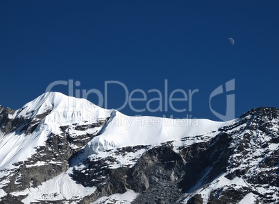 Moon Over A High Mountain In The Annapurna Conservation Area