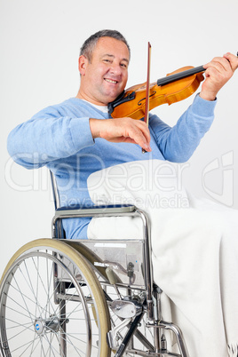 Man in wheelchair playing violin