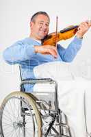 Man in wheelchair playing violin