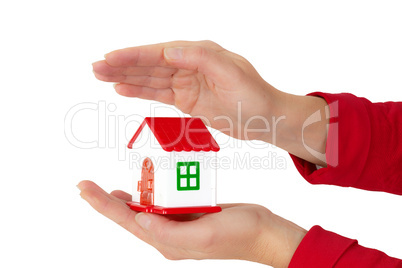 Woman hands holding house