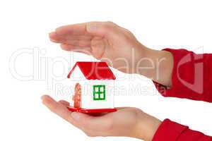 Woman hands holding house