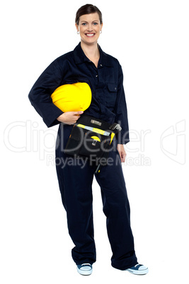 Relaxed construction worker with yellow helmet